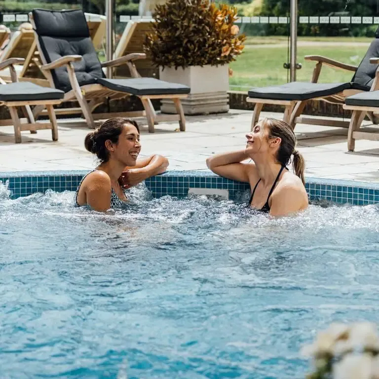 Friends talking in an outdoor hot tub